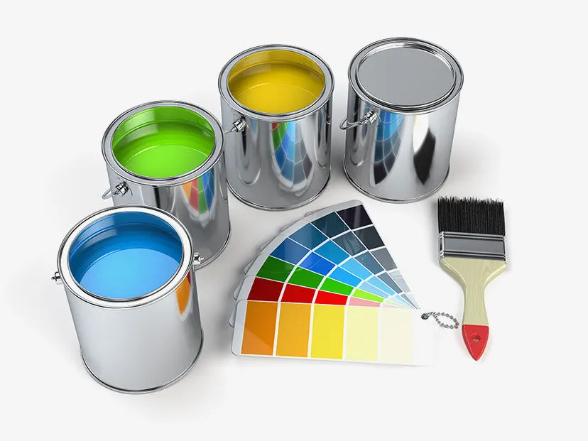 Paint cans, colour swatches and a brush